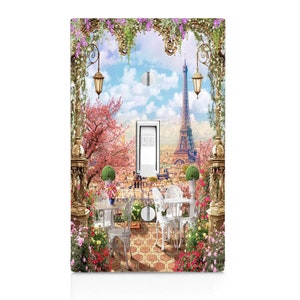 May include: A light switch cover featuring a Parisian scene with the Eiffel Tower, a cafe table and chairs, and blooming flowers. The switch is labeled "OFF".