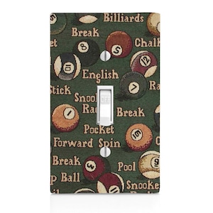 May include: A light switch cover with a green background and a pattern of billiard balls and related terms, such as "Break", "English", "Pocket", "Pool", and "Snooker".