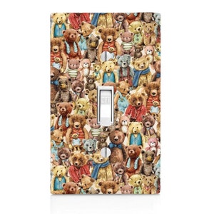 May include: A light switch cover with a pattern of teddy bears in various colors and poses. The switch is labeled "OFF".