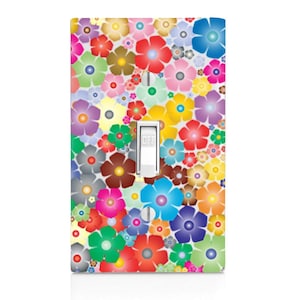 May include: A light switch cover with a colorful floral pattern. The cover features a variety of flowers in shades of red, pink, blue, green, yellow, and purple. The switch is labeled "OFF".