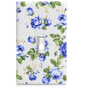 May include: A light switch cover with a white background and a blue floral pattern. The switch is labeled "OFF".