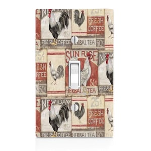May include: A light switch cover with a vintage design featuring roosters, text, and numbers. The cover has a red, white, and brown color scheme. The text on the cover includes "Fresh Coffee", "Herbal Tea", "Sun Rise", and "New Day".