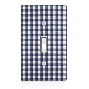 May include: A light switch cover with a blue and white gingham pattern. The switch is labeled "OFF".