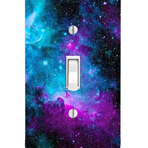 May include: A light switch cover with a galaxy design featuring a blue and purple nebula with stars. The switch is labeled "OFF".