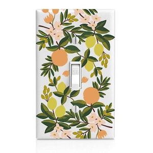 May include: White light switch cover with a floral pattern featuring green leaves, pink flowers, and yellow and orange citrus fruits.