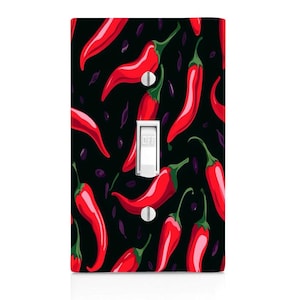 May include: A decorative light switch cover featuring a pattern of red chili peppers on a black background. The switch is white with the word "OFF" printed on it. The cover has two silver screws.