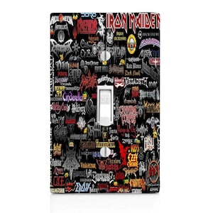 May include: A black light switch cover with a collage of various heavy metal band logos, including Iron Maiden, Megadeth, Slayer, and Cannibal Corpse. The logos are in various colors, including red, white, black, and yellow.