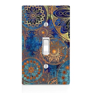 May include: A light switch cover with a blue and gold mandala pattern. The switch is labeled "OFF".