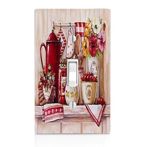 May include: A light switch cover with a vintage kitchen scene. The image features a red teapot, jars of preserves, a bowl of cherries, and a floral arrangement. The switch cover is labeled "OFF".