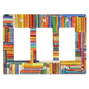 May include: A triple light switch wall plate featuring a colourful, multi-directional pattern of book spines. The design includes various titles such as 'Sew With The Flow', 'Happiness is Handmade', and 'Craft Addict' printed on the spines.