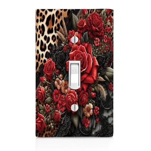 May include: A light switch cover with a floral design featuring red roses, black lace, and leopard print. The switch is labeled "OFF".