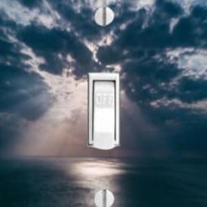 May include: A light switch cover with a photograph of a dramatic sunset over the ocean. The sky is a deep blue with dark clouds and the sun is setting behind the horizon, casting a golden glow on the water.