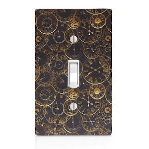 May include: A black light switch cover with a gold clock pattern. The switch is labeled "OFF".