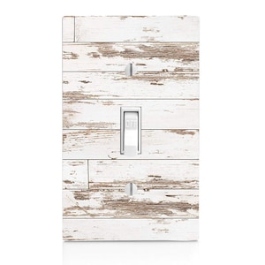 May include: White light switch cover with a distressed woodgrain design. The switch is labeled "OFF".