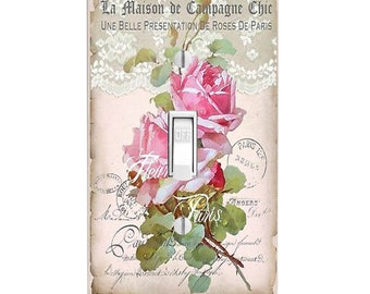 May include: A rectangular light switch cover plate featuring a vintage-style print of pink roses, green leaves, and white lace patterns. The text reads La Maison de Campagne Chic, Une Belle Presentation de Roses de Paris, and Paris.