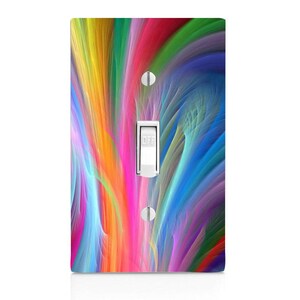 May include: A light switch cover with a colorful abstract design featuring streaks of pink, blue, green, yellow, and orange.