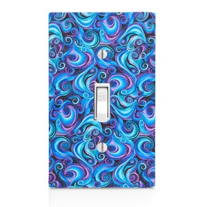 May include: A light switch cover with a blue and purple abstract swirl pattern. The switch is labeled "OFF".