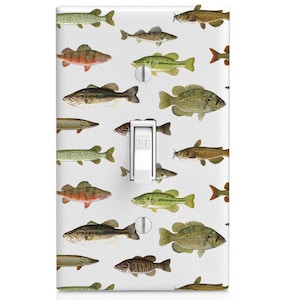 May include: A white light switch cover with a pattern of various fish, including bass, catfish, and pike. The switch is labeled "OFF".