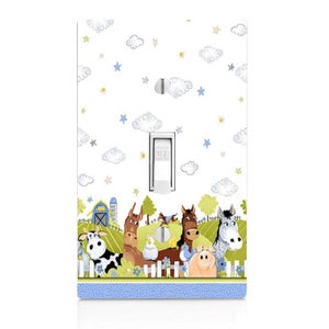 May include: A light switch cover with a white background and blue clouds. The bottom of the cover features a farm scene with a cow, a horse, a pig, a chicken, and a donkey. The text "OFF" is on the light switch.
