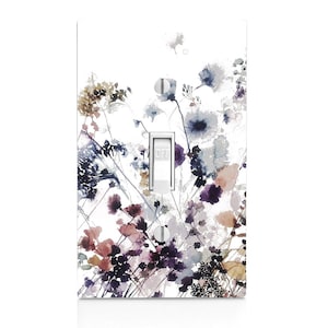 May include: A light switch cover with a watercolor floral design featuring shades of purple, blue, and brown. The switch is labeled "OFF".