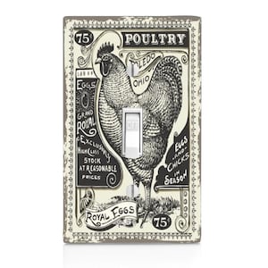 May include: A vintage-style light switch cover featuring a black and white illustration of a rooster with the text "Poultry Toledo Ohio" and "Royal Eggs" in a decorative frame.