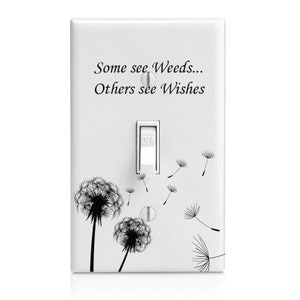 May include: White light switch cover with a black and white dandelion design. The text "Some see Weeds... Others see Wishes" is printed on the cover.