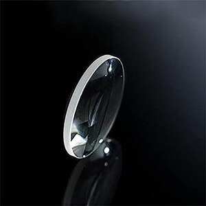 May include: A clear glass lens with a bevelled edge. The lens is round and has a slight curve to it.