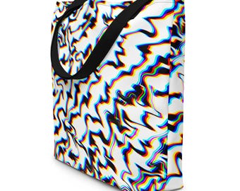 May include: A tote bag featuring a white background with a repeating pattern of distorted, wavy lines in vibrant red, blue, and yellow colors. The bag has two black fabric handles attached to the top, providing a contrast to the colorful design.