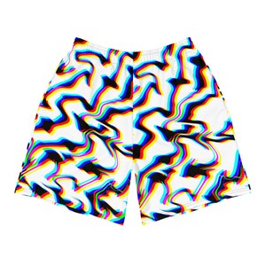 May include: White athletic shorts with a colorful, abstract pattern. The design features black, red, yellow, and blue wavy lines over a white background. The shorts have an elastic waistband.