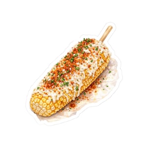 May include: A sticker of an ear of corn on the cob, covered in a creamy white sauce, red-orange seasoning, and green herbs. A wooden stick is inserted at one end. The corn is on a white background.