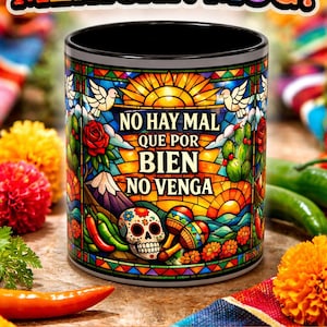 May include: A vibrant Mexican-style mug with the text "STUNNING MEXICAN MUG!". The mug showcases a stained-glass effect with a sugar skull, flowers, and the phrase "NO HAY MAL QUE POR BIEN NO VENGA".