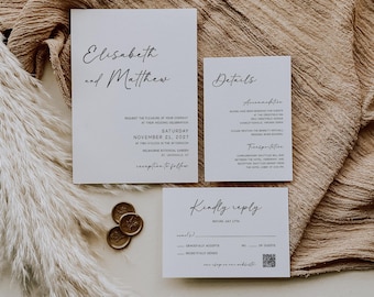 May include: A set of elegant wedding stationery featuring a main invitation, details card, and RSVP card. The cards are white with black calligraphy. Gold wax seals and dried pampas grass add decorative elements. The invitation reads "Elisabeth and Matthew".