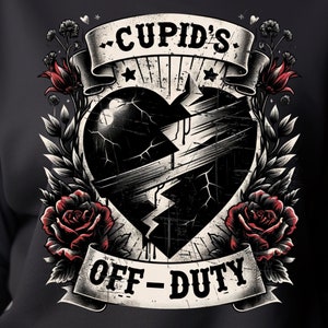 May include: Black sweatshirt with a graphic of a broken heart with a banner that reads "Cupid's Off-Duty". The heart is surrounded by roses and vines.
