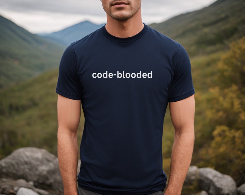 a man wearing a t - shirt that reads code - blooded