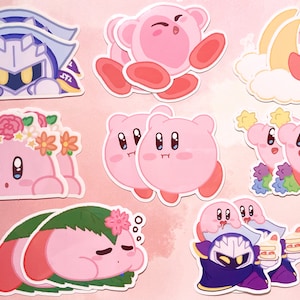 May include: A set of 10 pink and white stickers featuring a pink character with different expressions and poses. The character is wearing a flower crown, sleeping in a leaf, and holding a cake. The stickers also feature a blue and purple character with a crown.