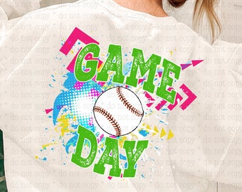 May include: White sweatshirt with a green, pink, and blue graphic design that says "GAME DAY" with a baseball in the center.