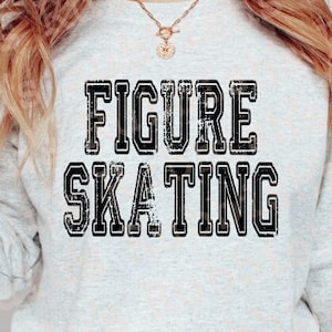 May include: A grey sweatshirt with the text "FIGURE SKATING" in black letters with a distressed look.