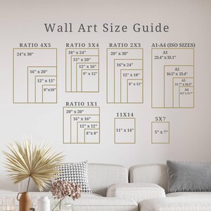 May include: A wall art size guide with different ratios and sizes for prints. The guide includes ratios like 4x5, 3x4, 2x3, 1x1, 11x14, and 5x7. It also includes standard ISO sizes like A1, A2, A3, and A4. The guide is displayed on a white wall with a couch in the foreground.
