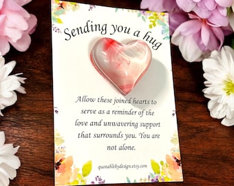 Roze marmeren glazen hartzakknuffel: liefdes- en steunmunt