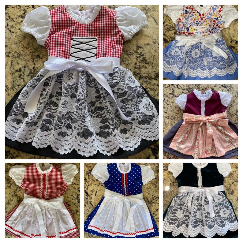 Pode incluir: Uma cole&ccedil;&atilde;o de vestidos dirndl coloridos. Os vestidos apresentam v&aacute;rios designs, incluindo xadrez vermelho, estampas florais e cores s&oacute;lidas. Cada vestido tem uma saia de renda branca, um avental branco e um la&ccedil;o na cintura. Os vestidos t&ecirc;m mangas curtas e bufantes.
