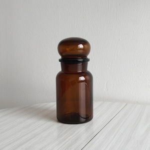 Antique apothecary jar in brown glass, vintage decoration, translucent pharmacy jar, retro kitchen or bathroom accessory