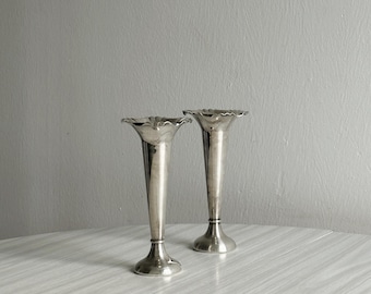 Pair of shiny silver-plated metal vases, chic tableware for weddings, refined buffets or elegant centerpieces