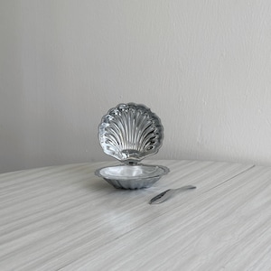 Metal butter dish with lid and spoon, caviar pot, shell design, shiny metal, chrome metal tableware