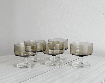 Set of 5 smoked glass coupes, vintage dessert or champagne glasses, retro tableware, transparent base, elegant 70s tableware