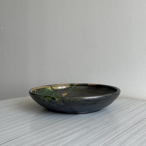 large fruit basket dish in colorful ceramic, terracotta pottery, rustic kitchen decor, antique object with a strong and unique character