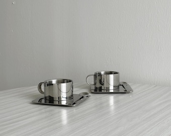 Designer stainless steel cup with tray and spoon, modern tableware, trendy kitchen decor, elegant and minimalist tableware gift