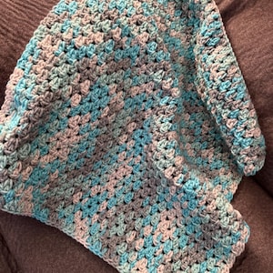 May include: A handmade wooden sign with the text "Welcome" in a playful font. The sign features a distressed finish and a simple, rustic design, perfect for a front door or entryway. The sign is approximately 12 inches wide.