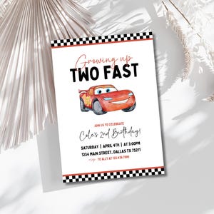 May include: A red and white birthday invitation with a cartoon red race car. The invitation says "Growing up TWO FAST" and "Cole's 2nd Birthday!" with details for the party.