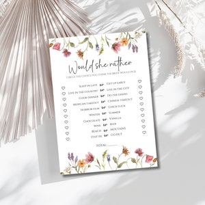 Peut inclure: Un jeu de douche nuptiale imprimable avec une bordure florale. Le jeu demande aux invités de cercler leur choix pour chaque question, comme "Dormir tard ou se lever tôt ?" et "Chocolat ou vanille ?" Le jeu se termine par un score total.