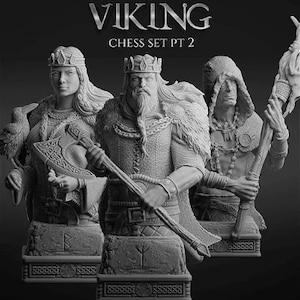 May include: Three grey resin Viking chess pieces, a king, queen, and a warrior, on a black background. The king and queen are wearing crowns and the warrior is holding a torch. The chess pieces are part of a Viking chess set.